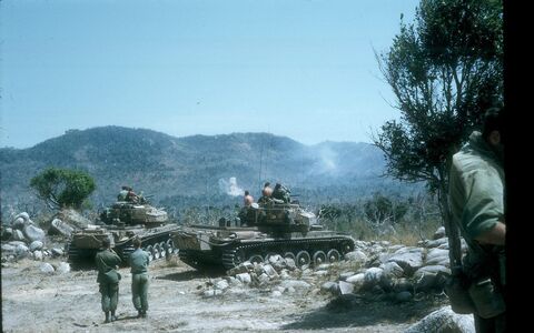 8 RAR troops and Centurion tanks of 1 Armd Regt at Night Defensive Position Isa in February 1970. The tanks are firing into the hills.