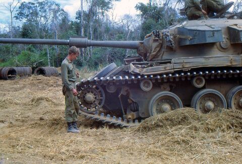 32 Charlie after having been escorted back to FSB Dyke. Temporary repairs had been made to the damaged suspension station. Rus Kiellerup is inspecting the damage.