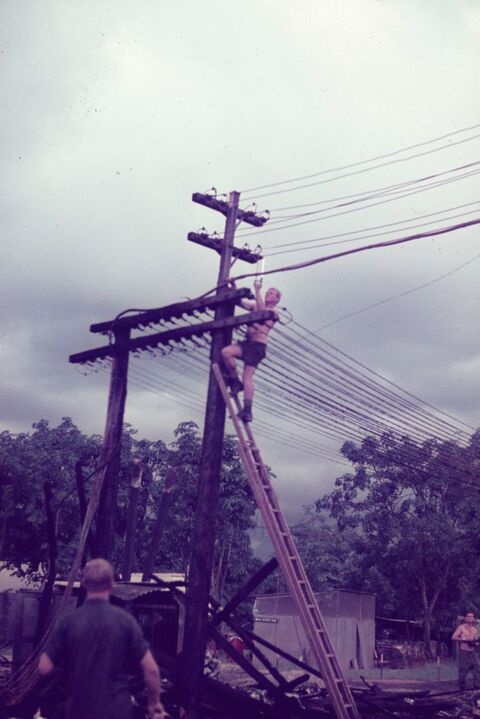 Engineers laying the new Power lines that burnt down during the fire that destroyed the Power Plant.