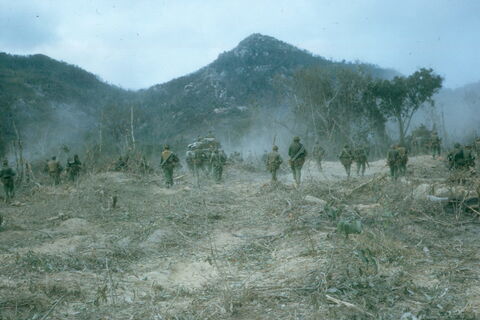C Company 8 RAR assaulting into an enemy bunker system in the foothills of the Long Hais (Minh Dam Secret Zone) shortly after a B52 strike had hit the system.